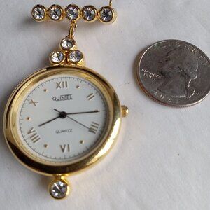 Bright and Shining Gold Tone Quintel Rhinestone Brooch Watch